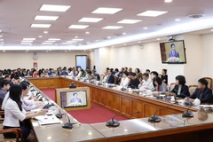 Các đại biểu dự hội nghị tại điểm cầu Thông tấn xã Việt Nam (Hà Nội). (Ảnh: Dương Giang/TTXVN)