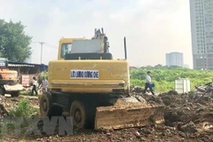 Hiện trường một buổi thu hồi đất ở Hà Nội. (Nguồn: TTXVN)