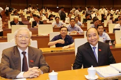 Tổng Bí thư, Chủ tịch nước Nguyễn Phú Trọng và Thủ tướng Nguyễn Xuân Phúc tại phiên họp chiều 1/4. (Ảnh: Trí Dũng/TTXVN)