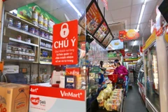 Một siêu thị đã mở cửa phục vụ khách hàng ở ngõ 24 đường Kim Đồng, sáng 13/9. (Ảnh: Hoàng Hiếu/TTXVN) 