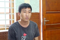 Đối tượng Lê Gia Huy tại cơ quan công an. (Ảnh: TTXVN phát)