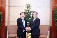 Ông Nguyễn Phước Lộc (phải), Phó Bí thư Thành ủy Thành phố Hồ Chí Minh tiếp ông Khamsay Saysompheng, Bí thư, Tỉnh trưởng tỉnh Houaphanh. (Ảnh: Xuân Khu/TTXVN)