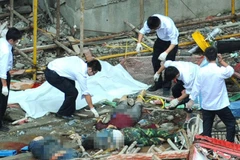 Vụ tai nạn thang máy ở Vũ Hán (Trung Quốc) làm 19 người thiệt mạng hồi tháng 9/2012. (Ảnh: english.caixin.com)