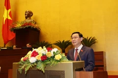 Chủ tịch Quốc hội Vương Đình Huệ đọc Tờ trình Danh sách đề cử để Quốc hội bầu Chủ tịch nước. (Ảnh: Văn Điệp/TTXVN)