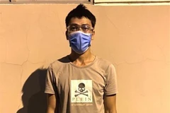 Đối tượng Phạm Văn Tân bị bắt giữ. (Ảnh: TTXVN phát)