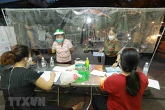 Ban quản lý chợ triển khai đăng ký cho tất cả các tiểu thương vào chợ. (Ảnh: Vũ Sinh/TTXVN)