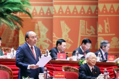 Ủy viên Bộ Chính trị, Thủ tướng Chính phủ Nguyễn Xuân Phúc thay mặt Đoàn Chủ tịch điều hành Đại hội. (Ảnh: TTXVN)