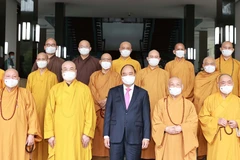 Chủ tịch nước Nguyễn Xuân Phúc với các đại biểu tại buổi tiếp. (Ảnh: Thống Nhất/TTXVN)