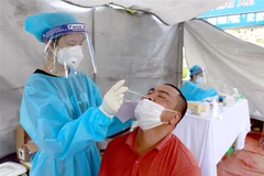 Xét nghiệm nhanh COVID-19. (Nguồn: TTXVN)