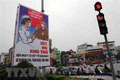 Tranh cổ động tấm lớn về phòng chống COVID-19. (Ảnh minh họa: Thanh Tùng/TTXVN)