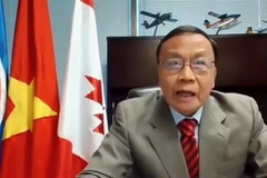 Tổng Lãnh sự Việt Nam tại Vancouver Nguyễn Quang Trung tham gia và phát biểu tại hội thảo. (Ảnh: Quang Thịnh/TTXVN)