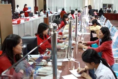 Giao dịch tại Agribank. (Nguồn: TTXVN)