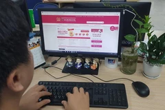 Khách hàng của Agribank có thể chuyển tiền nhanh 24/7 qua Napas. (Ảnh: T.H/Vietnam+) 