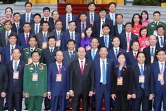 Chủ tịch nước Trần Đại Quang với các đại biểu tại buổi gặp mặt. (Ảnh: Nhan Sáng/TTXVN)