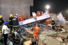Hiện trường một vụ sập nhà ở Trung Quốc hôm 30/10. (Nguồn: THX/TTXVN)