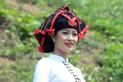 Vẻ đẹp của phụ nữ Thái khi mặc trang phục truyền thống của dân tộc. (Ảnh: Phan Tuấn Anh/TTXVN)