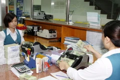 Thận trọng, linh hoạt trong điều hành tiền tệ năm 2014