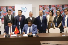 Phó Chủ tịch Thường trực Quốc hội Trần Thanh Mẫn chứng kiến Lễ ký Thỏa thuận về Phương thức tổ chức Hội nghị Nghị sỹ trẻ toàn cầu lần thứ 9. (Ảnh: Nguyễn Trường/TTXVN)