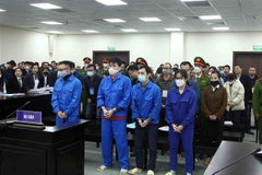 Các bị cáo tại phiên tòa ngày 26/12/2022. (Ảnh: Phạm Kiên/TTXVN)