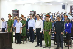 Các bị cáo nghe Hội đồng xét xử tuyên án. (Ảnh: Doãn Tấn/TTXVN)