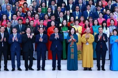 Thủ tướng Phạm Minh Chính với các đại biểu dự Hội nghị người Việt Nam ở nước ngoài trên toàn thế giới lần thứ IV. (Ảnh: Dương Giang/TTXVN)