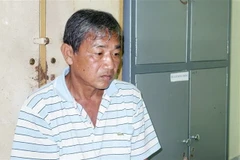 Đối tượng Trần Văn Hải tại cơ quan điều tra. (Ảnh: TTXVN phát)