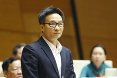 Phó Thủ tướng Vũ Đức Đam trả lời câu hỏi chất vấn của đại biểu Quốc hội. (Ảnh: Doãn Tấn/TTXVN)