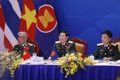 Đại tướng Ngô Xuân Lịch, Ủy viên Bộ Chính trị, Phó Bí thư Quân ủy Trung ương, Bộ trưởng Quốc phòng Việt Nam phát biểu khai mạc chương trình làm việc. (Ảnh: Dương Giang/TTXVN)