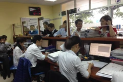 Hà Nội yêu cầu xử lý nghiêm chủ đầu tư thu phí cấp sổ đỏ trái quy định