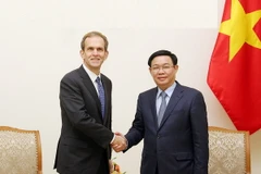 Phó Thủ tướng Vương Đình Huệ tiếp ông Kent Walker, Phó Chủ tịch Cấp cao về các vấn đề toàn cầu của Google. (Ảnh: Nguyễn Dân/TTXVN)