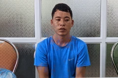 Đối tượng Sần Sành Mình tại cơ quan công an. (Ảnh: Hoàng Tiến/TTXVN phát)