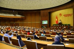 Quốc hội họp phiên toàn thể tại hội trường để nghe trình bày Tờ trình về dự án Luật Điện ảnh (sửa đổi) và Tờ trình về dự án Luật Thi đua, khen thưởng (sửa đổi). (Ảnh: Văn Điệp/TTXVN)