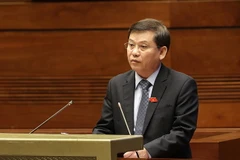 Viện trưởng Viện Kiểm sát Nhân dân Tối cao Lê Minh Trí trình bày Tờ trình về dự án Luật sửa đổi, bổ sung một số điều của Bộ luật Tố tụng hình sự. (Ảnh: Dương Giang/TTXVN)