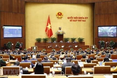 Quốc hội biểu quyết thông qua dự thảo Nghị quyết về phân bổ ngân sách trung ương năm 2022. (Ảnh: Doãn Tấn/TTXVN)