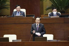 Bộ trưởng Bộ Lao động-Thương binh và Xã hội Đào Ngọc Dung trả lời nhóm vấn đề thứ hai thuộc lĩnh vực lao động, thương binh và xã hội. (Ảnh: Doãn Tấn/TTXVN)