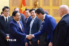 Thủ tướng Phạm Minh Chính với các thành viên Đoàn doanh nghiệp của Hội đồng Kinh doanh Hoa Kỳ-ASEAN (USABC). (Ảnh: Dương Giang/TTXVN)