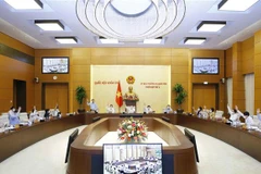 Ủy ban Thường vụ Quốc hội biểu quyết thông qua định mức phân bổ dự toán chi thường xuyên ngân sách nhà nước năm 2022. (Ảnh: Doãn Tấn/TTXVN)