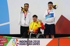 Vận động viên Võ Thanh Tùng giành Huy chương Vàng tại Asian Para Games. (Ảnh: Tấn Phúc/Vietnam+)