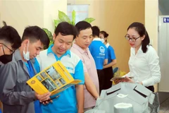 Một góc Triển lãm "Kết nối cung-cầu đối với các sản phẩm phụ trợ, sản phẩm trung gian trong các khâu sản xuất, nhằm thúc đẩy kinh tế tuần hoàn trong các ngành công nghiệp." (Ảnh: Xuân Khu/TTXVN)