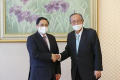 Thủ tướng Phạm Minh Chính hội kiến Chủ tịch Hạ viện Nhật Bản Hosoda Hiroyuki. (Ảnh: Dương Giang/TTXVN)