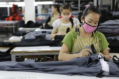 Công nhân may ở Lào. (Nguồn: Chinadaily)