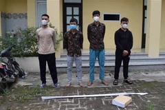 Các đối tượng tại cơ quan công an. (Ảnh: Đinh Tuấn/TTXVN)