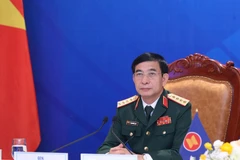 Đại tướng Phan Văn Giang, Bộ trưởng Bộ Quốc phòng Việt Nam dự tại điểm cầu Hà Nội. (Ảnh: Trọng Đức/TTXVN)