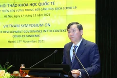 Phó giáo sư-tiến sỹ Lê Văn Lợi, Phó Giám đốc Học viện Chính trị Quốc gia Hồ Chí Minh phát biểu khai mạc hội thảo. (Ảnh: Văn Điệp/TTXVN)