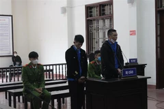 Bị cáo Đỗ Văn Đức và Lê Ngọc Trọng tại phiên tòa. (Ảnh: Vũ Hà/TTXVN)