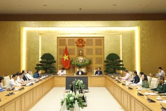 Phó Thủ tướng Vũ Ðức Ðam chủ trì cuộc họp. (Ảnh: Văn Điệp/TTXVN)