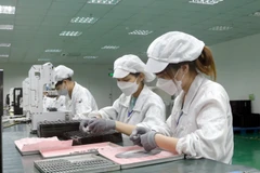 Người lao động trở lại làm việc tại doanh nghiệp trong Khu công nghiệp của Bắc Giang sau kỳ nghỉ Tết. (Ảnh: Đồng Thúy/TTXVN)