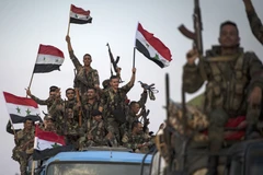 Binh sỹ Syria tiến vào tiếp quản thành phố Qamishli, miền Đông Bắc Syria ngày 25/10/2019. (Nguồn: AFP/TTXVN)