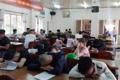 Các đối tượng tại cơ quan công an. (Nguồn: TTXVN phát)