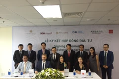 Lễ ký Hợp đồng huy động 400 tỷ đồng giữa PAN Farm và các nhà đầu tư trong nước và quốc tế. (Ảnh: PV/Vietnam+)
